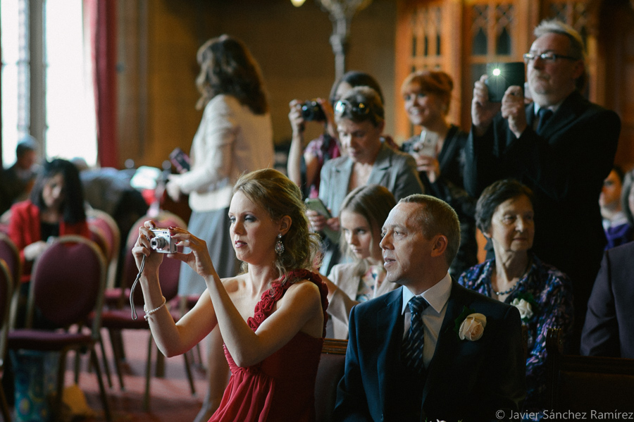 Guests taking photos at the wedding ceremony in Manchester